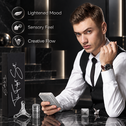 Professional at his desk holding the metallic Sensory Deck cards beside the Classic Fidget Set pieces